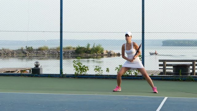 Powerful forehand. Girl playing tennis