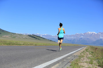 Fototapeta premium healthy lifestyle young woman runner running on trail