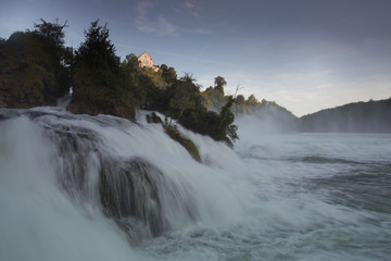 Rheinfall and the castle Laufen. The largest Europian waterfall during a summer sunset. Swizerland.