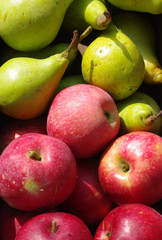 Red apples and green pears close up