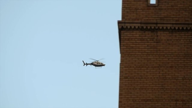 helicopter flying by. chopper aircraft in flight. police observation background