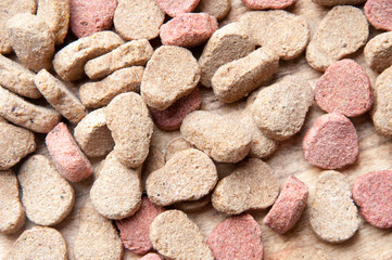 The image of dog food on a wooden table