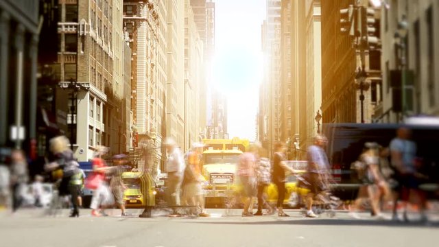 people walking on crowded street in the city. pedestrians commuters background
