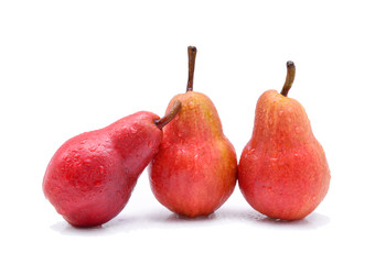 Red pear with water drops isolated on white background