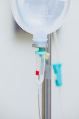 Closeup saline (IV) drip for patient in hospital.