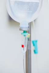 Closeup saline (IV) drip for patient in hospital.