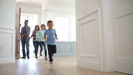 Slow Motion Shot Of Hispanic Family Moving Into New Home  - Powered by Adobe