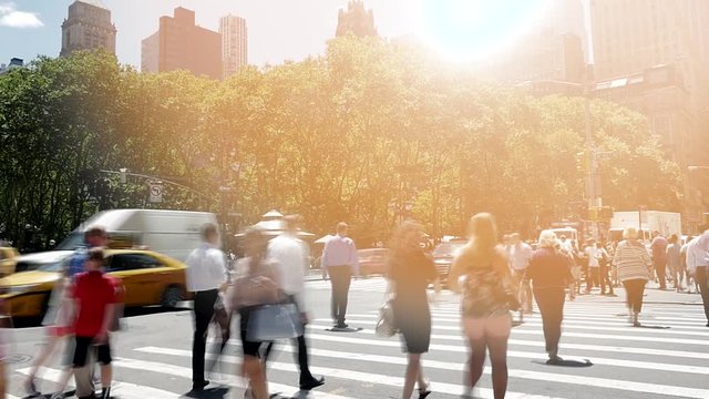people walking on crowded street in the city. pedestrians commuters background