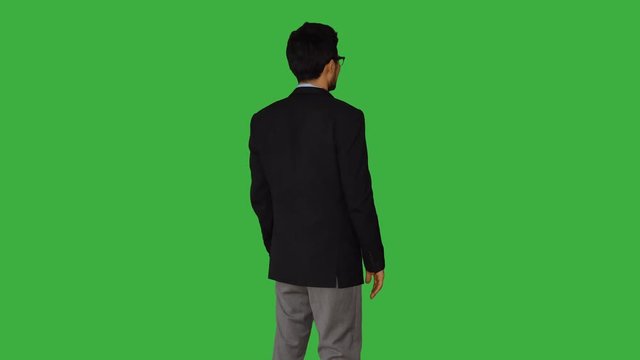 portrait of young asian women standing isolated against green screen background