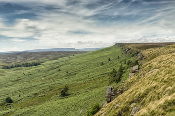 Fototapeta na wymiar Magnificent landscape of rock formations and moorland at Stanage Edge in the Peak District in Derbyshire, a stunning area of great natural beauty covering 555 square miles across central England