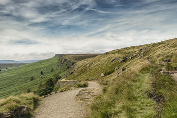 Naklejka premium Magnificent landscape of rock formations and moorland at Stanage Edge in the Peak District in Derbyshire, a stunning area of great natural beauty covering 555 square miles across central England