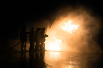 Firefighter Fireman Attack Fire with High Pressure Water