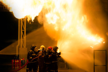 Firefighter Fireman Attack Fire with High Pressure Water