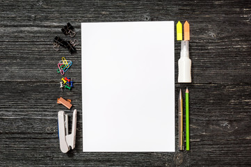 Empty sheet with office supplies