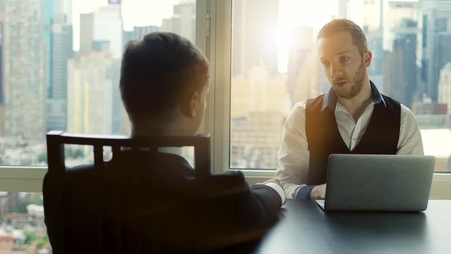 job interview business meeting of two young man in modern office. conversation