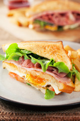 bacon and ham sandwich with french fries