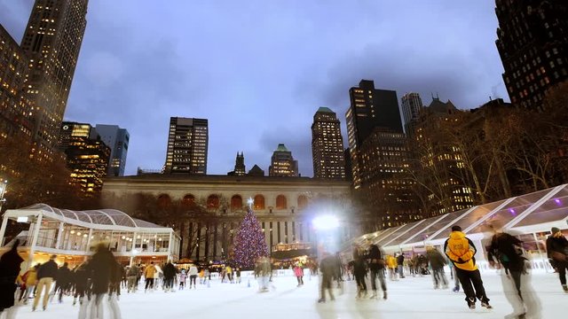 Ice Skating Rink At Bryant Park In New York City. People Enjoying Holidays