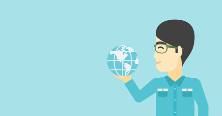 Businessman holding Earth globe.
