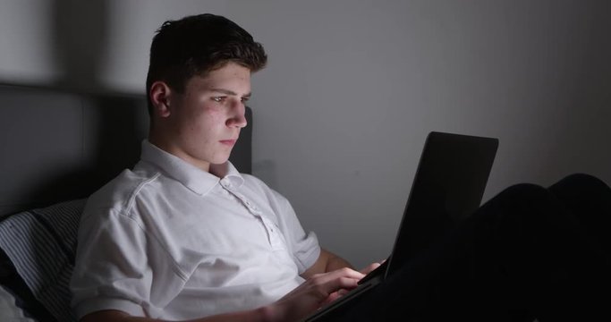 Teenage Victim Of Cyber Bullying Using Laptop 