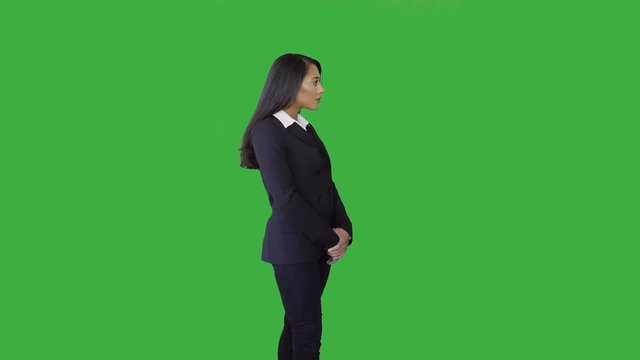 attractive black women in business suit isolated on green screen background