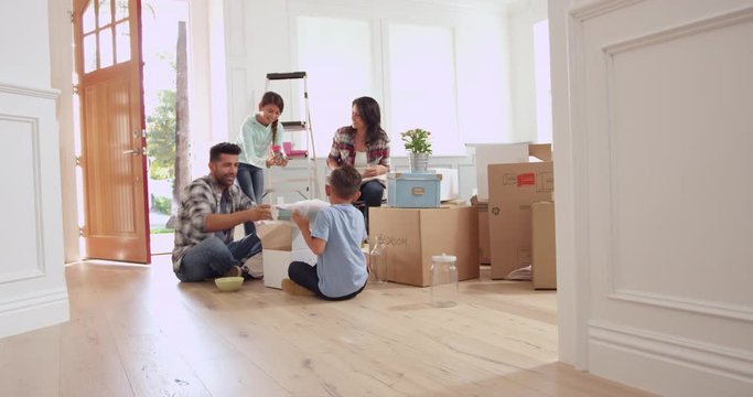 Hispanic Family Moving Into New Home 