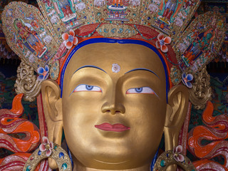 Head of a golden Buddha inside  temple at Thikse monastery. Ladakh, India