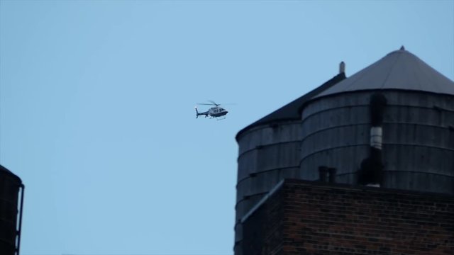 NYPD Police Helicopter flying by. public safety background