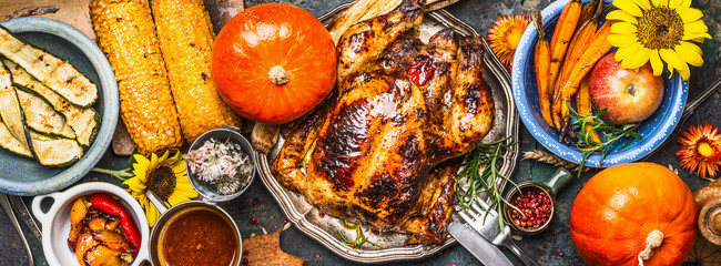 Thanksgiving Day food. Various grilled vegetables ,roasted chicken or turkey and pumpkin with...