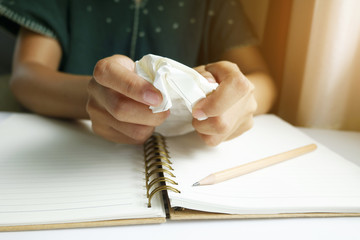 woman hands make up set with  paper and making paper ball