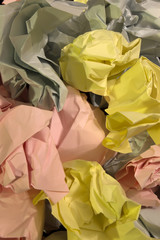This is a photograph of crumpled textured Blue,Yellow and Pink construction paper background