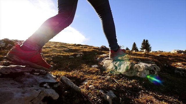 hiking activity outdoors. recreational pursuit. foot steps slow motion