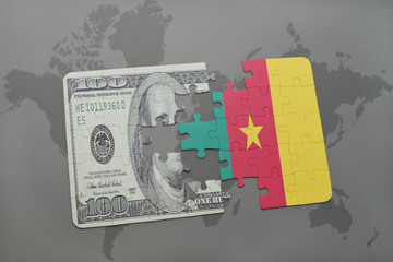 puzzle with the national flag of cameroon and dollar banknote on a world map background.