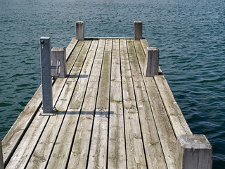 Obraz premium Wooden pier jetty in a marina