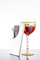 Red wine and chocolate bar, selective focus