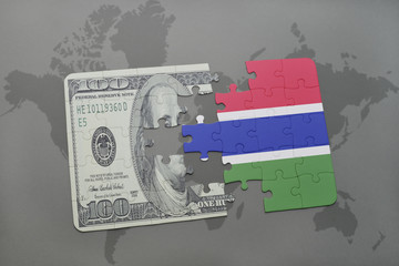 puzzle with the national flag of gambia and dollar banknote on a world map background.