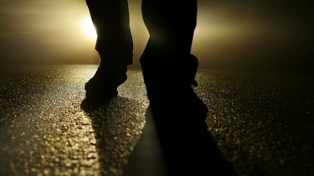 suspicious person walking into dark night. spooky scary mystic scene background