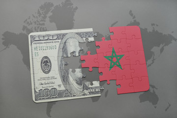 puzzle with the national flag of morocco and dollar banknote on a world map background.
