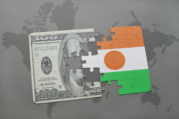 puzzle with the national flag of niger and dollar banknote on a world map background.