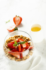 Homemade dessert with granola and berries