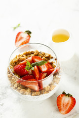 Homemade dessert with granola and berries