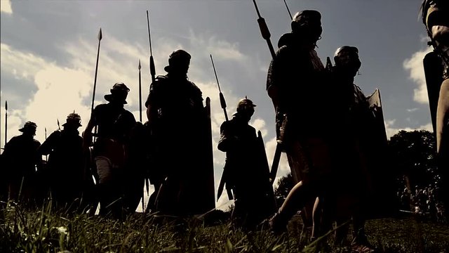 troop of historical gladiators marching together. 