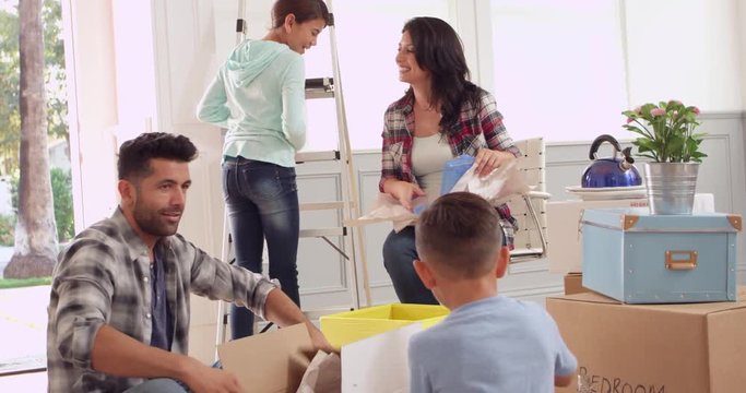 Hispanic Family Moving Into New Home 