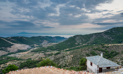 Blue hour over the village of Kastro, Thassos, Greece - view towards the mount Atos in the distance - obrazy, fototapety, plakaty