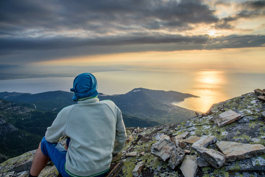 Sunrise over Thassos Island, Greece - view from Mount Ipsarion - person enjoying the view