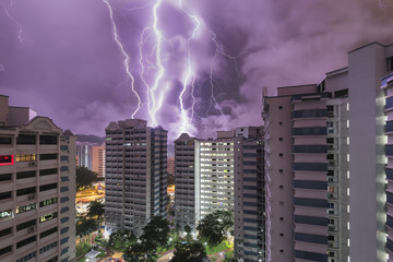 HDB flats in Singapore at night with dramatic thunder storm