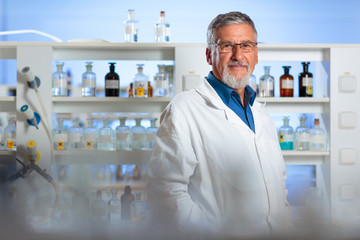 Senior chemistry professor/doctor in a lab 