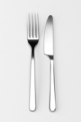 Fork and knife on grey