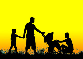 silhouette of a happy family walking with stroller at sunset