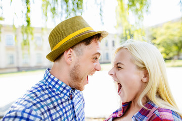 Young happy couple hugging and laughing..beautiful young couple fooling around in the park