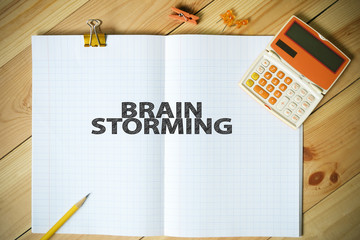 BRAIN STORMING text on paper in the office , business concept